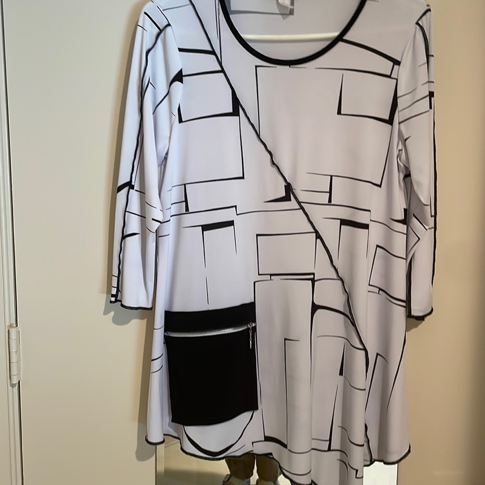 Sophisticated styling in this adorable top